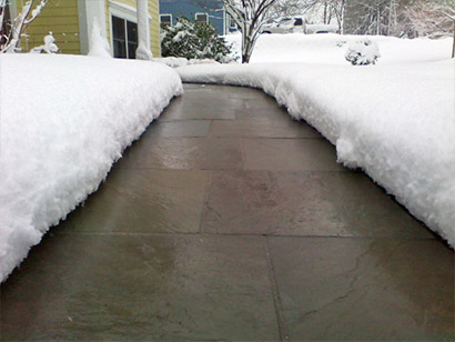 Heated paver walkway after a snowstorm. Heated paver sidewalk after a snowstorm.